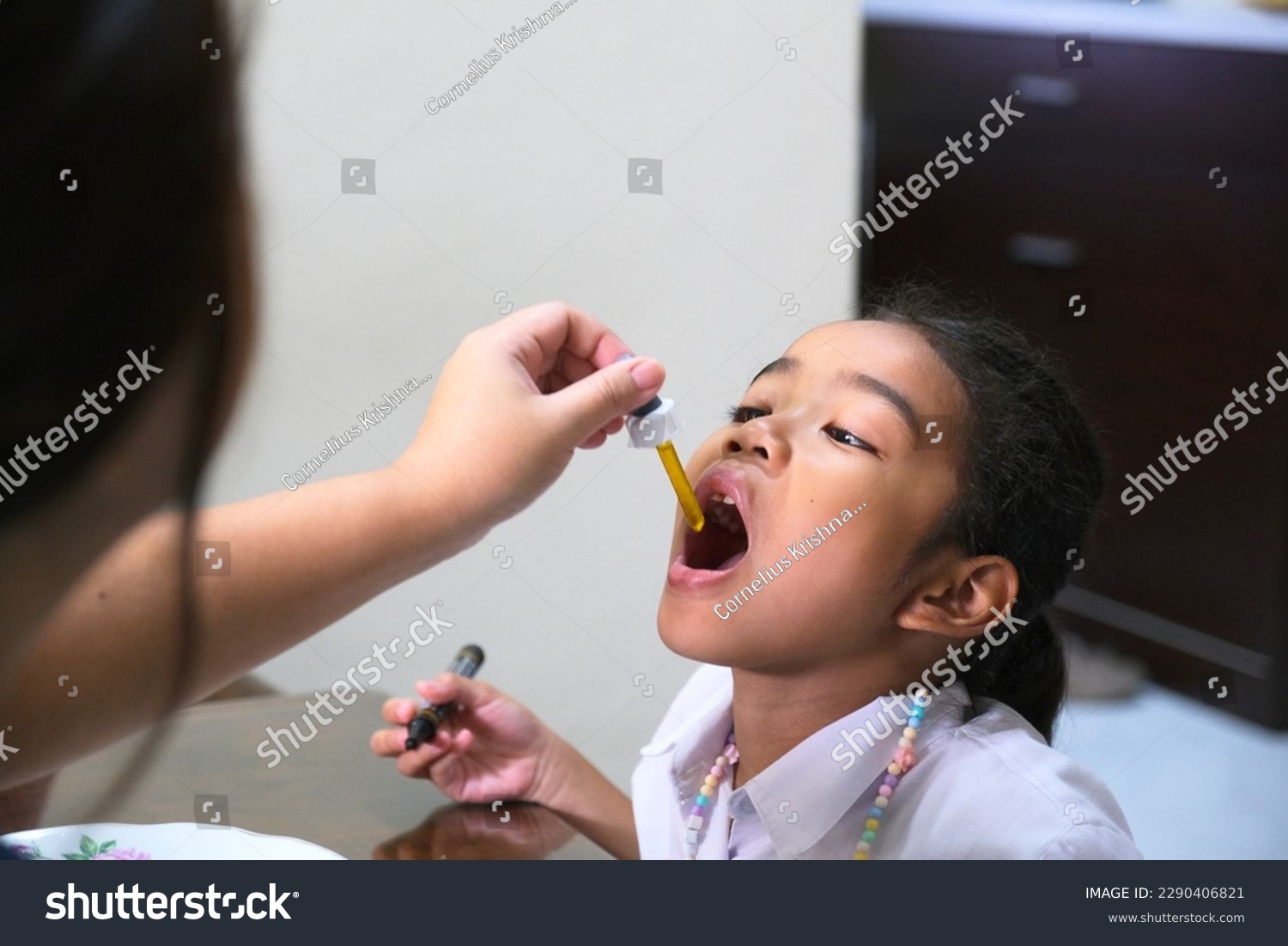 stock-photo-asian-little-girl-having-drops-medicine-2290406821