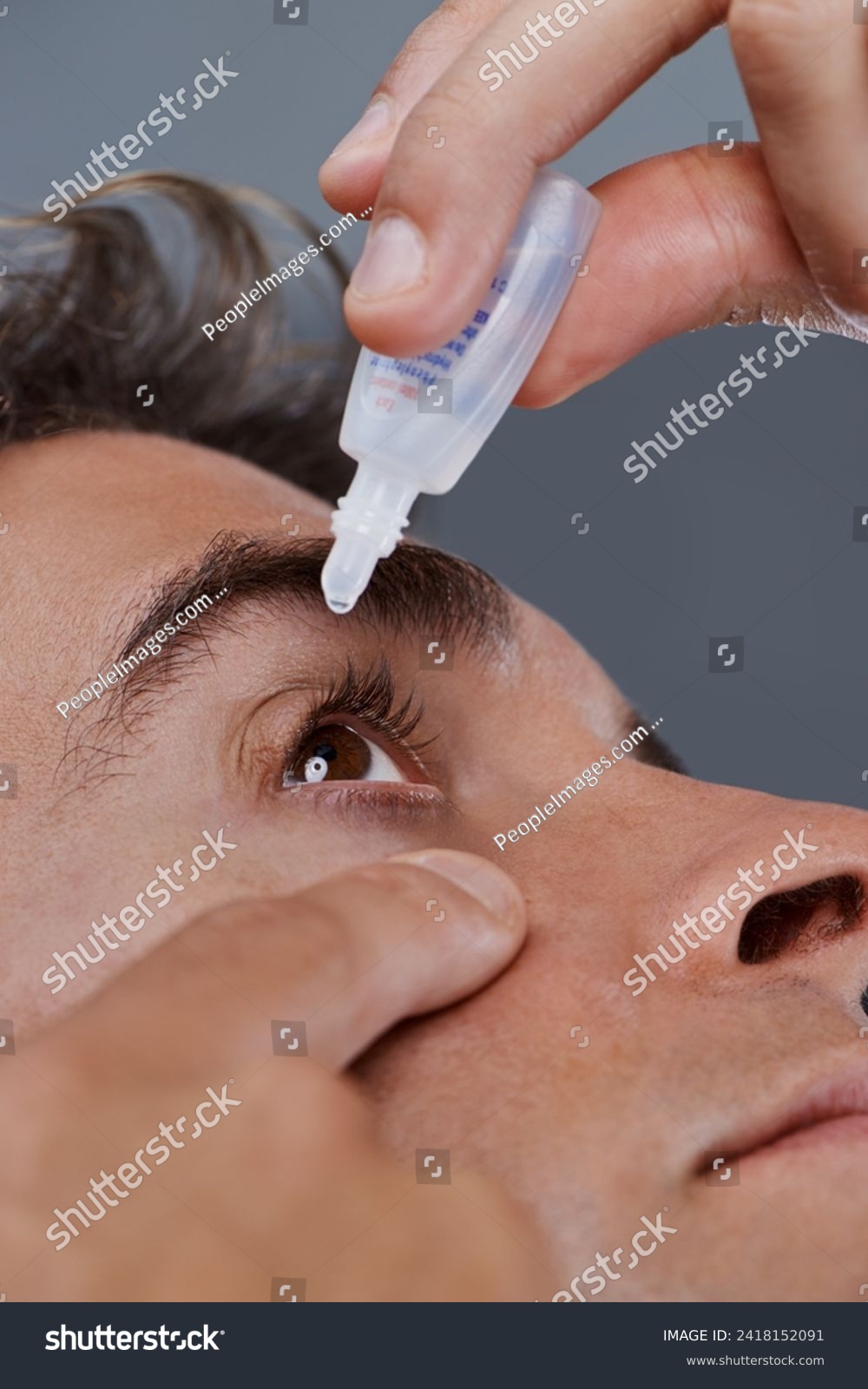 stock-photo-man-eye-drops-and-vision-for-allergies-or-treatment-in-studio-or-healthcare-wellness-dropper-or-2418152091